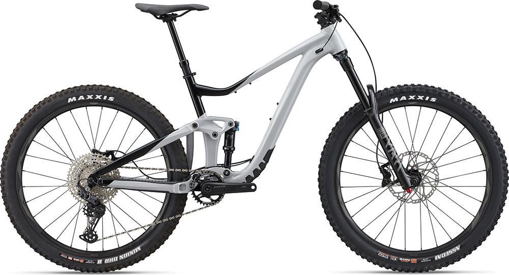 White full suspension all mountain bike with the brand Maxxis written on the tires